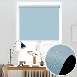 A cordless roller blind in blue, adorned with water droplets