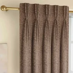 Pinch Pleat brown curtain with gold trim and pattern, adding elegance to the room