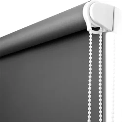 A close-up of a roller blind with chains, providing privacy and light control