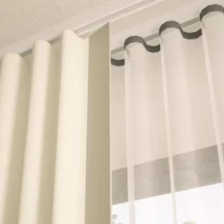 S Fold white curtain with black trim, adding elegance to the room decor