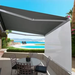 A patio with a retractable awning and Straight Drop Crank Blinds