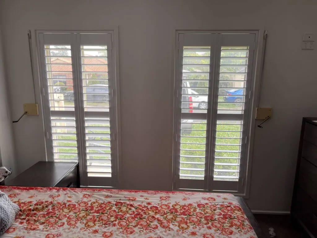 white plantation shutters in the bedroom