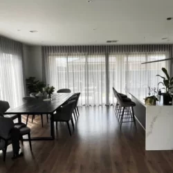 white transparent curtains fixed in the dining area