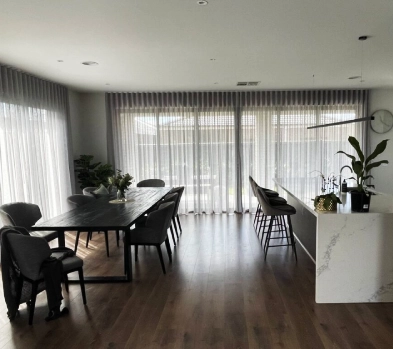 white transparent curtains fixed in the dining area