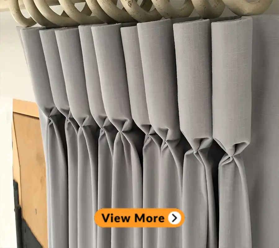 goblet pleat curtains with rings hanging in a room