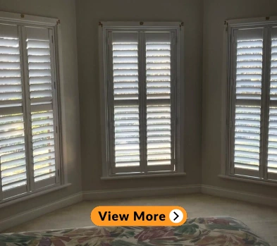 white plantation shutter installed in a room